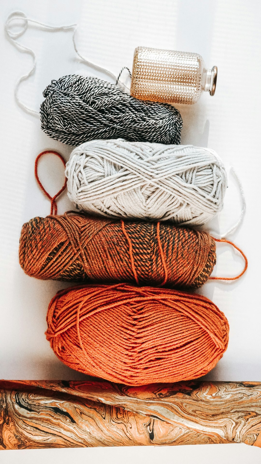 Different yarn skeins showing a range of crochet yarn weights and textures