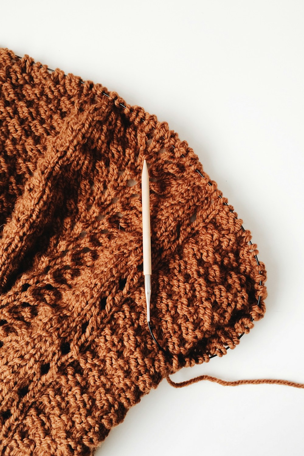 Close-up of warm brown ribbed yarn texture for an easy crochet beanie